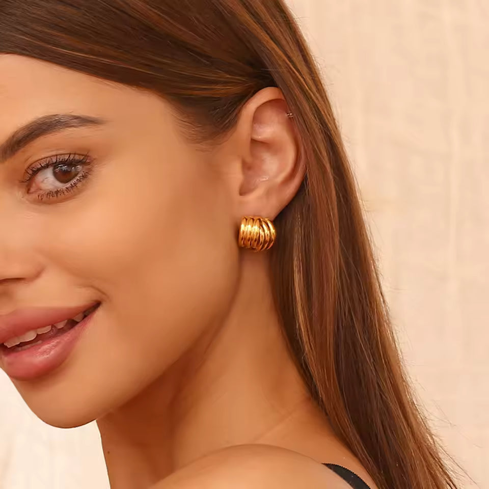 Layered gold stud earrings