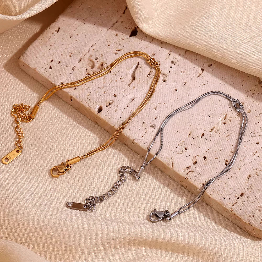 Thin knotted bracelet both cols