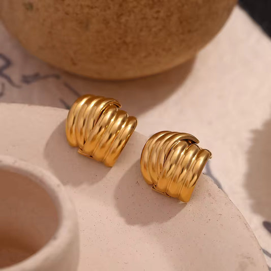 Layered gold stud earrings