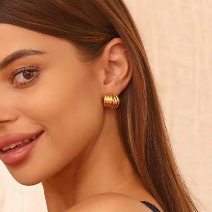 Layered gold stud earrings