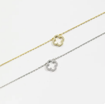 hollow clover necklace flat lay
